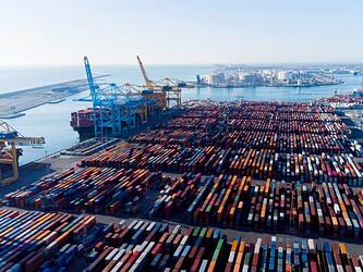 shipping containers and cargo ships at the port of barcelona